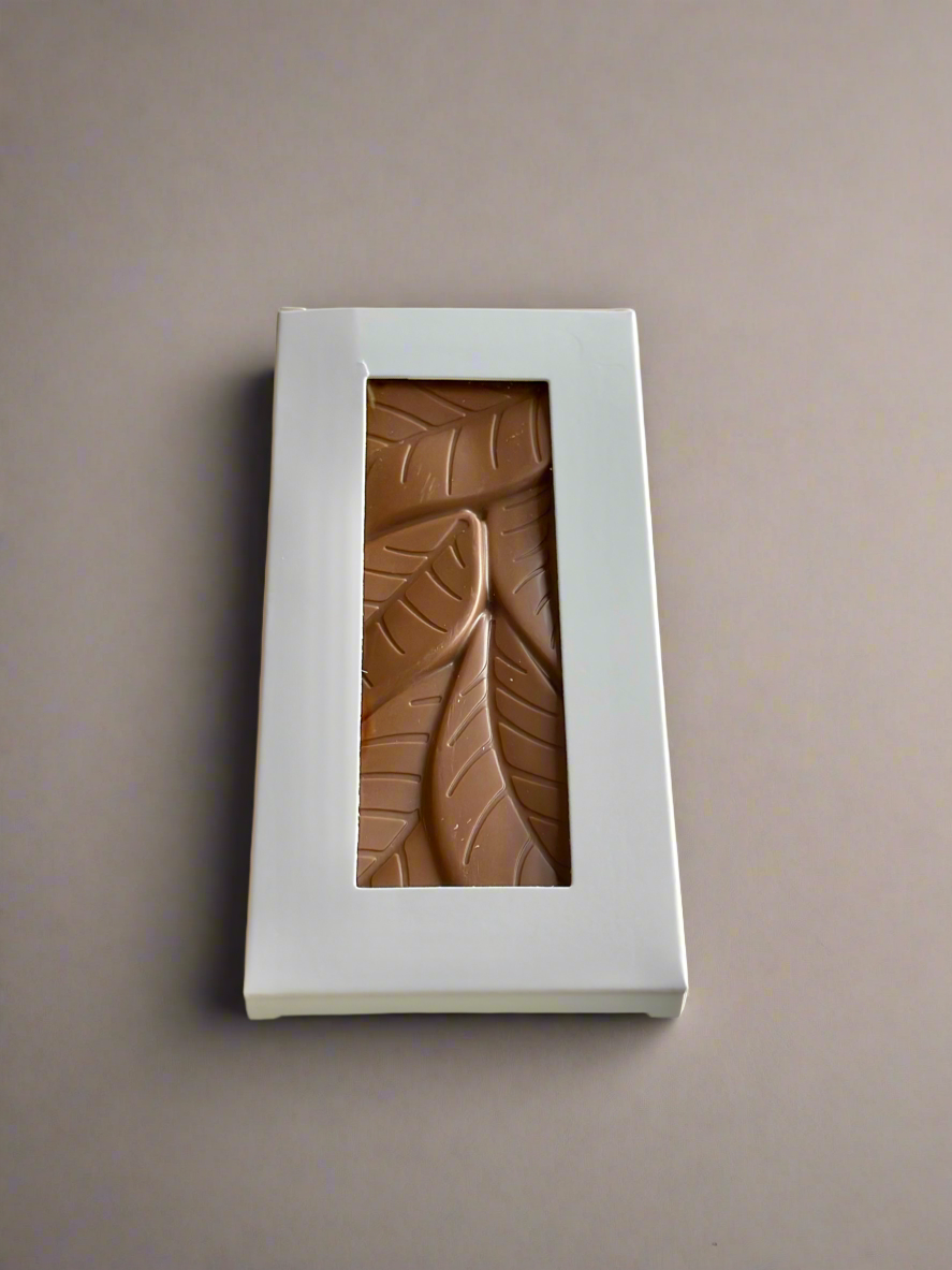 Milk chocolate bar in a white box