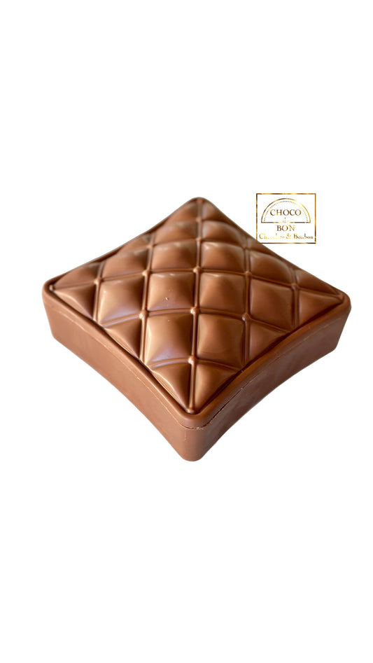 Square chocolate box with a textured surface on a white background, featuring the Choco Box logo.